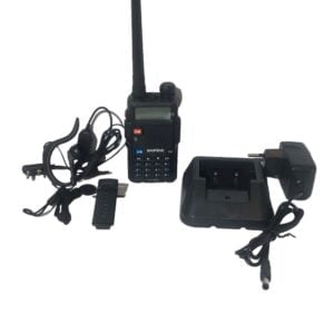 Portable amateur radio transceiver with accessories.