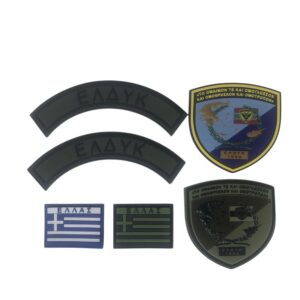 Σήματα και αυτοκόλλητα ΕΔΥΚ πάνω σε λευκό φόντο